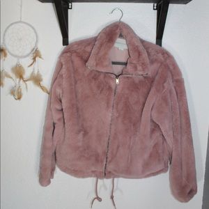 Fluffy pink jacket.